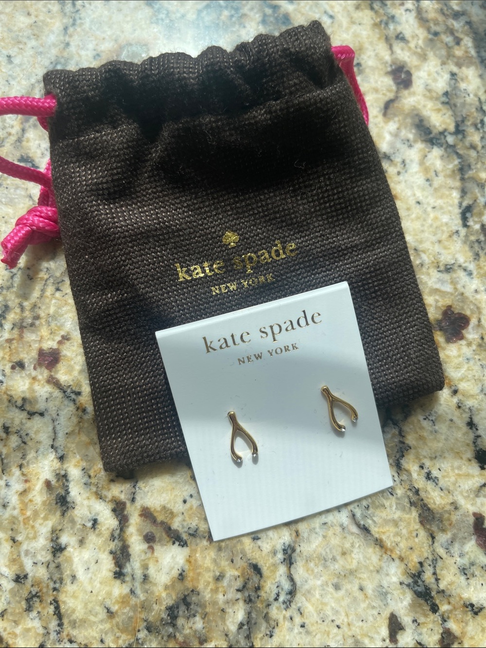 kate spade gold wishbone stud earrings with “diamond” details